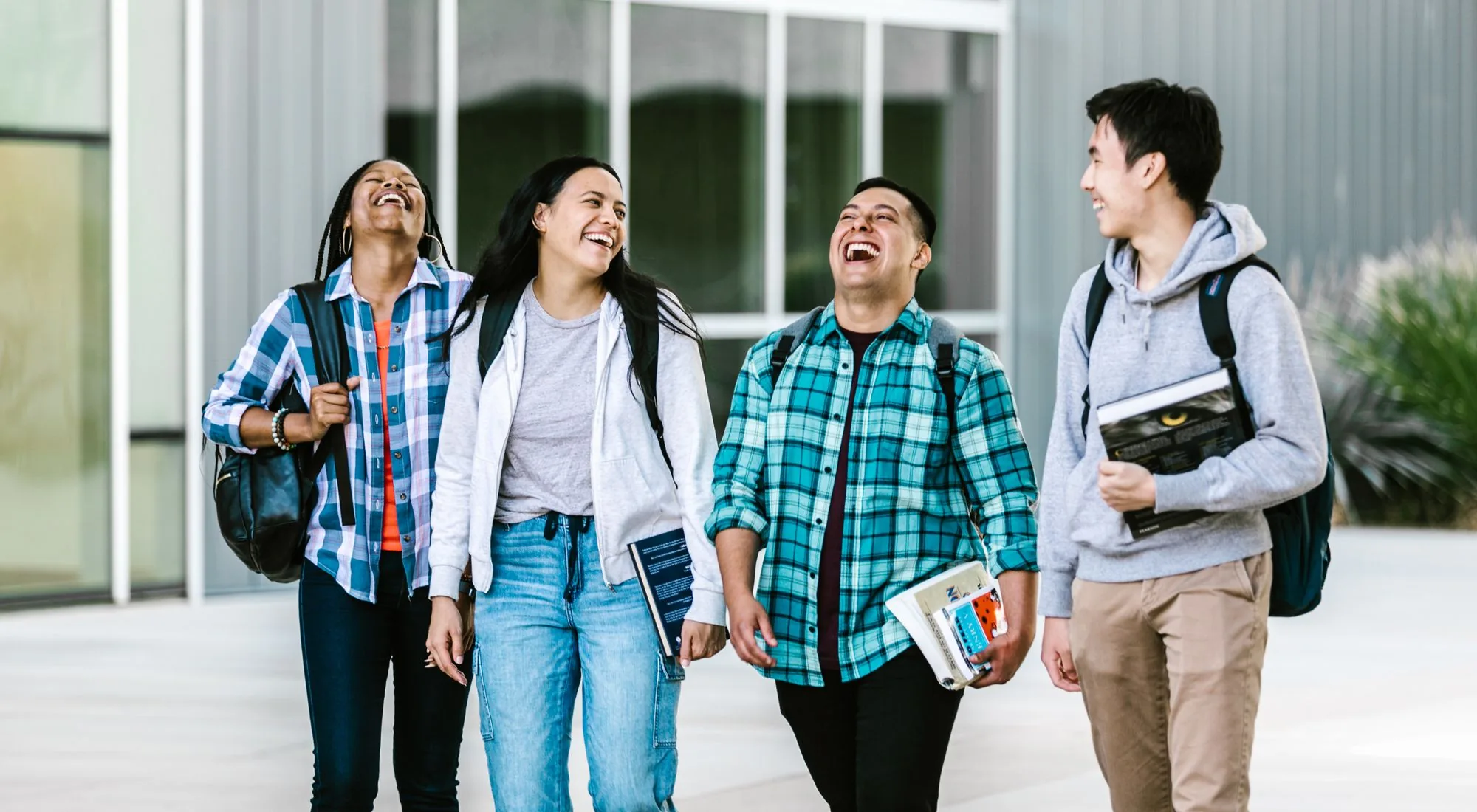 Gen Z students engaging in authentic word-of-mouth marketing on a college campus